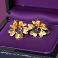 Vintage Gold Flower Shaped Earrings with Purple Gemstone Center